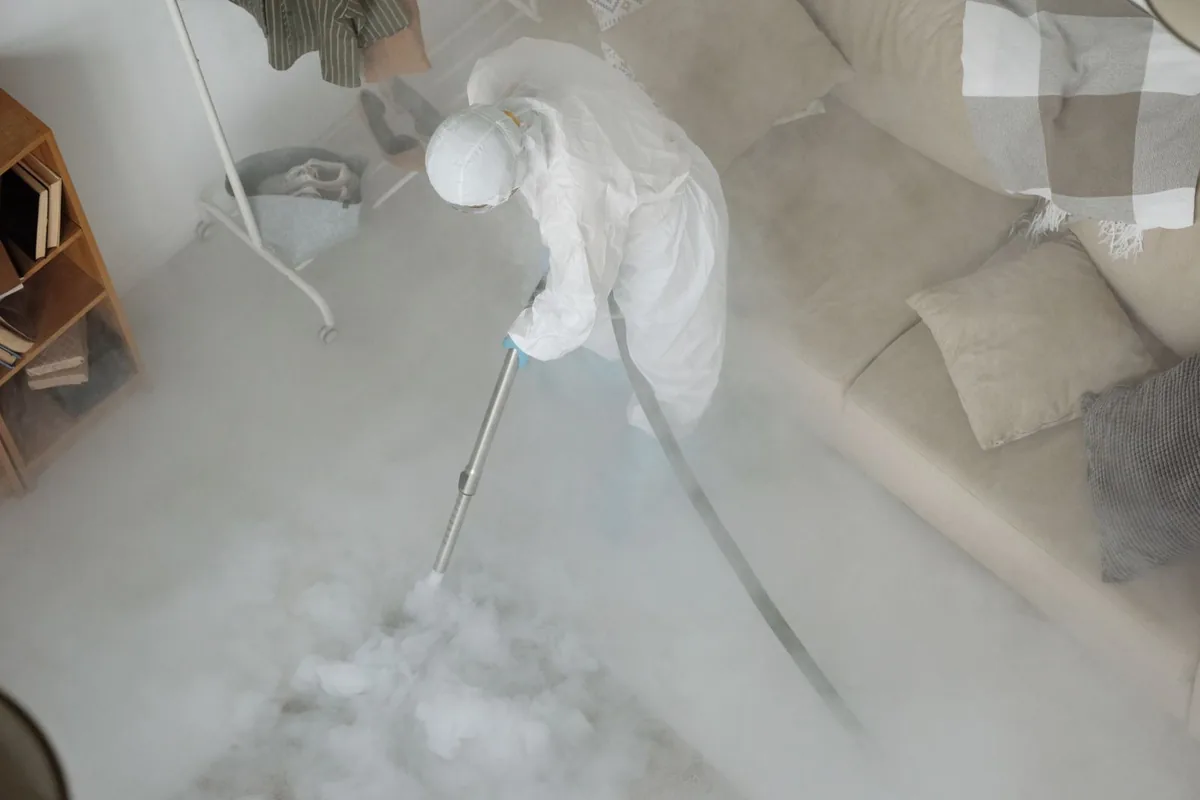 Biohazard cleanup technician in protective equipment, Cold Spring Park, Milwaukee, WI